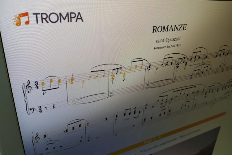 Photo of a screen showing Clara Schumann's Romanze in a-minor (digital score) with rehearsal highlights